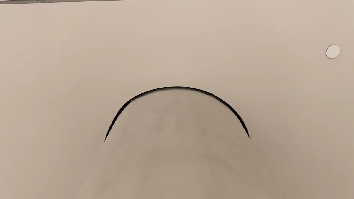 Curved shadow gap detail in a ceiling