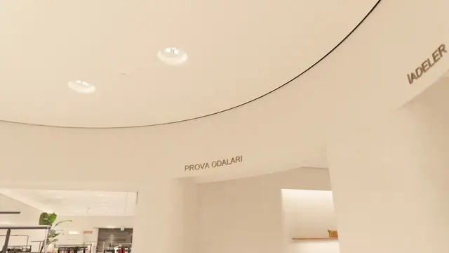 Curved ceiling and fitting rooms
