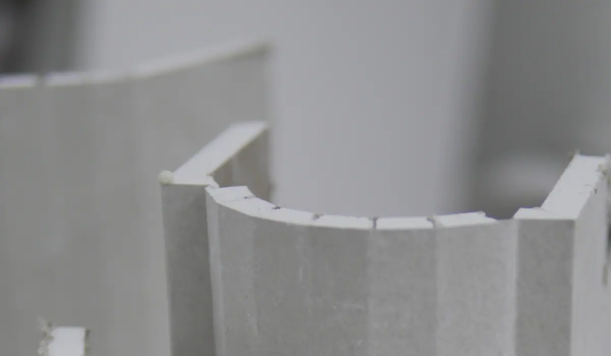 BendBoard gypsum board with V-grooves cut and bent into a curve